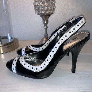 BLACK & WHITE TRIM BCBG PUMPS